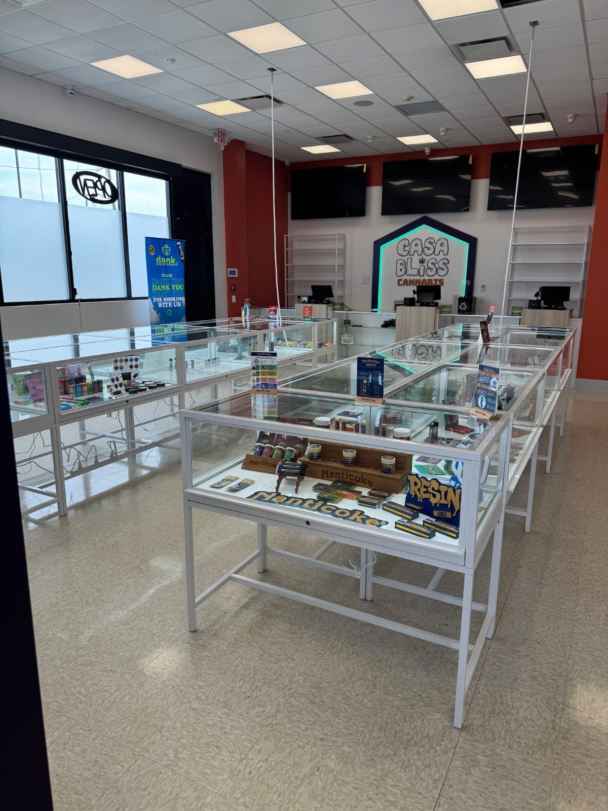 The welcoming Casa Bliss sales floor with glass cases and the lit Casa Bliss sign