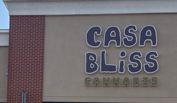 The Casa Bliss Cannabis sign on the storefront wall